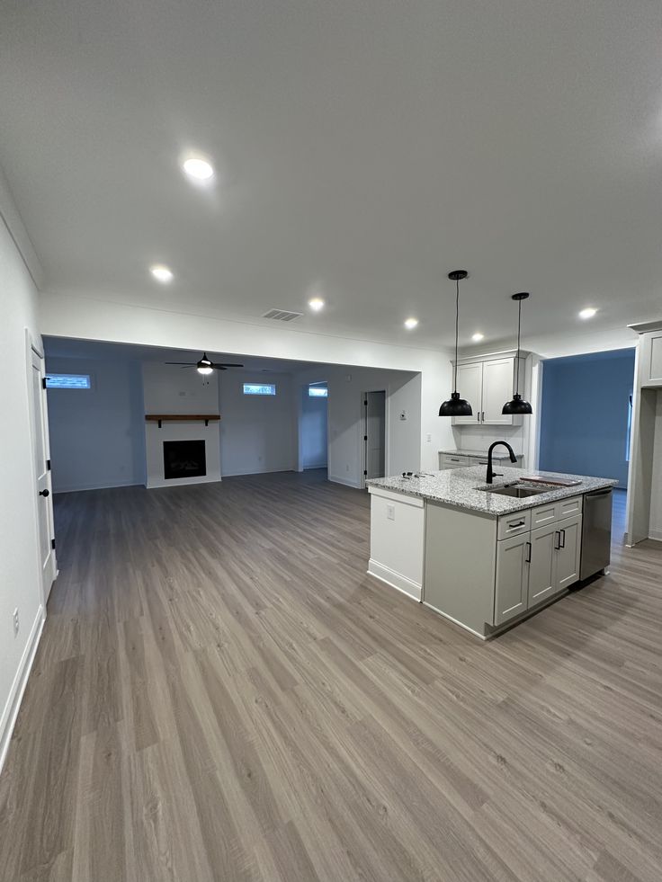 Newly installed wide-plank white oak hardwood flooring in a renovated Etobicoke room